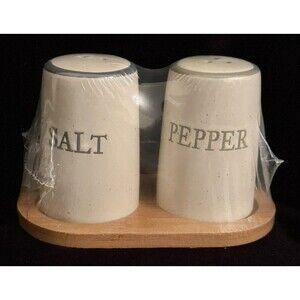 Ceramic Salt and Pepper Shakers on Wooden Stand
